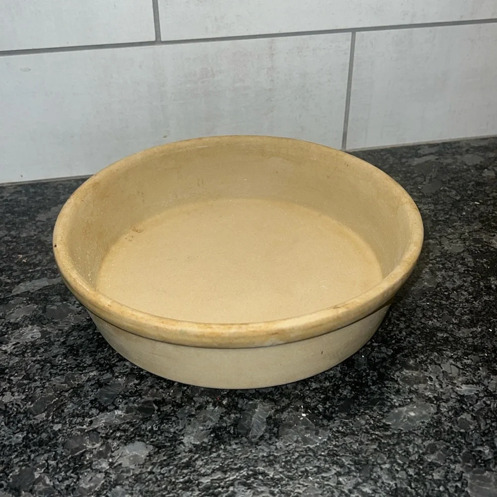 8” stone baker by Pampered Chef. Stone is partially seasoned since used.